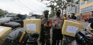 Polda Riau Bagikan Ratusan Ribu Masker Polda Riau Bagikan Ratusan Ribu Masker